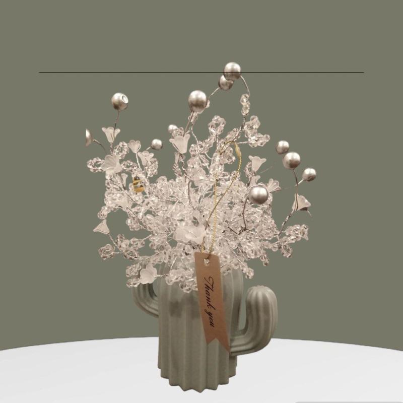 A Decorative White Tree With A Plastic Base