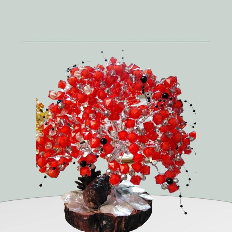 A Decorative Red Tree With A Wooden Base